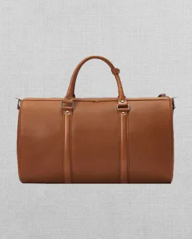 TAN LEATHER DUFFEL BAG WITH LOCK CLOSURE
